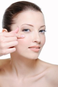 Woman showing under eye area for restylane injection